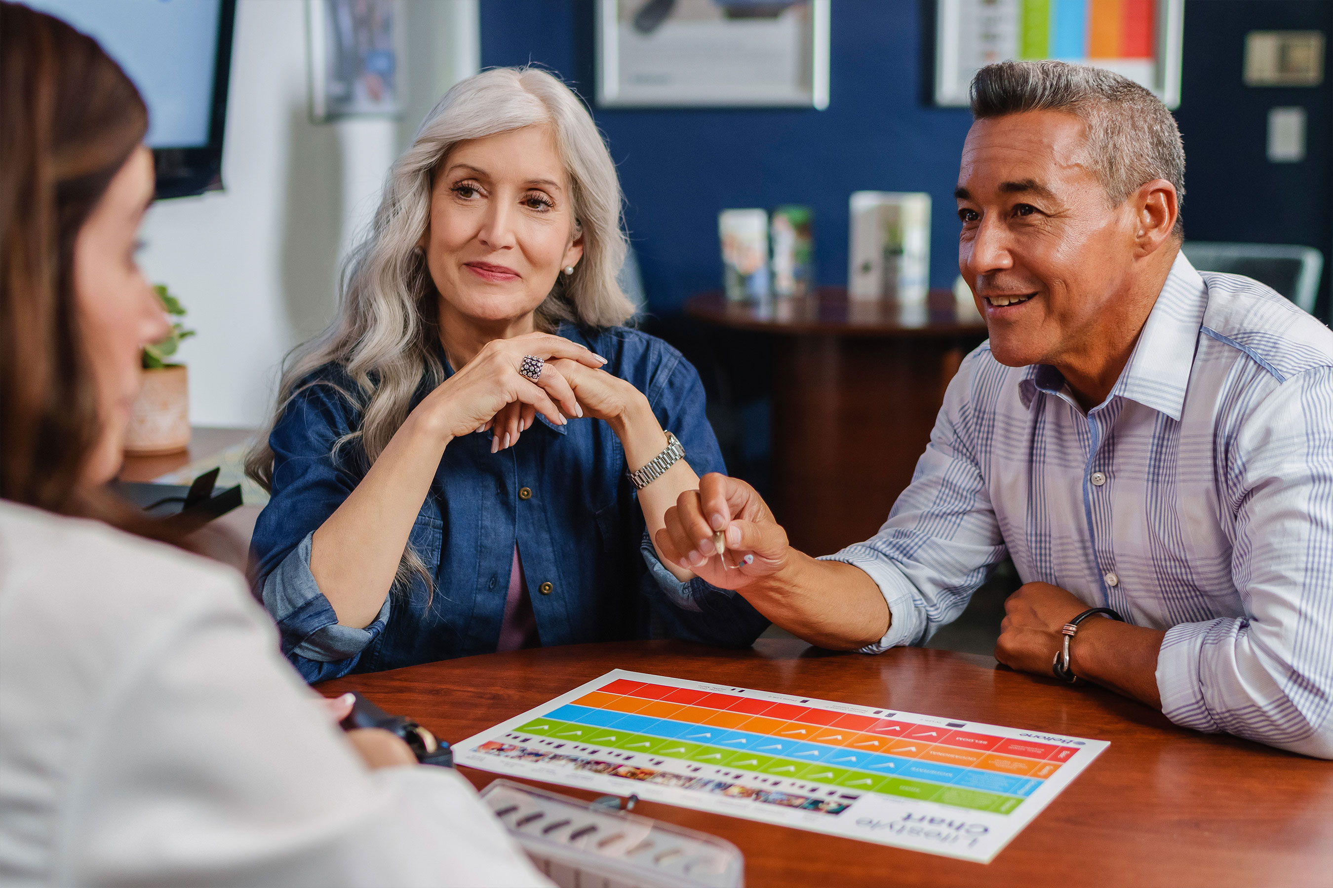 Beltone hearing care professional discussing hearing aid options with her patient.