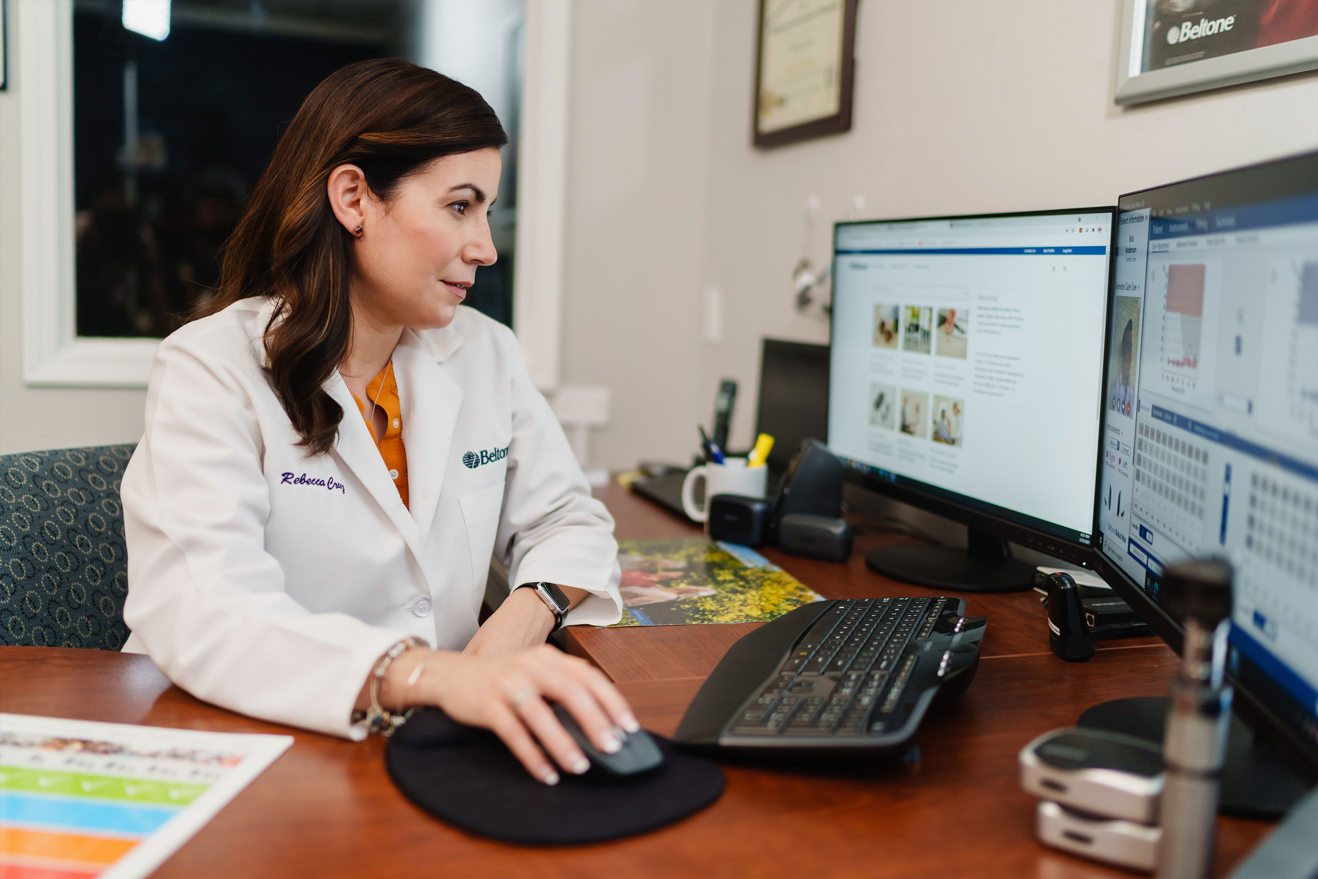 Beltone hearing care professional reviewing the results of her patient’s hearing screening.